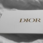 White dior box on a textured surface